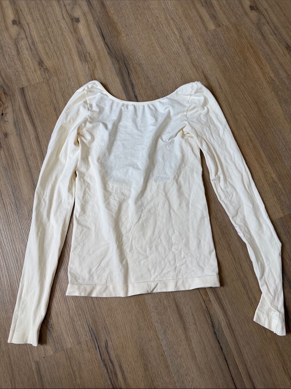 Classic Cream Long-Sleeve Women's Top with low back.